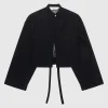 Oversize-Material Mix Crop Bluse mit dekorativem Knopf und Binde-Detail